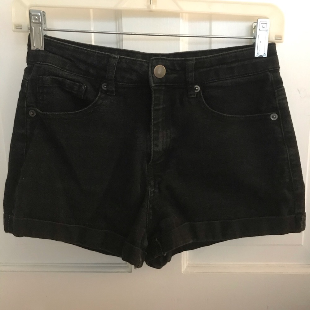 Black high-waisted denim shorts.